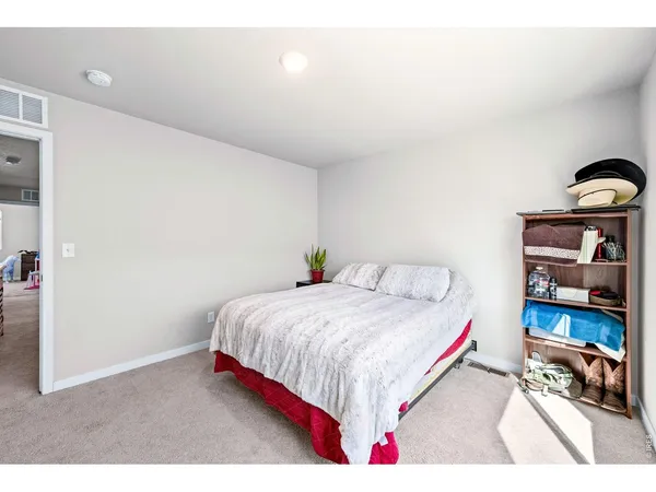 a bedroom with a bed and a cabinets