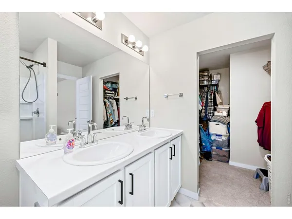 a bathroom with a sink vanity and a mirror