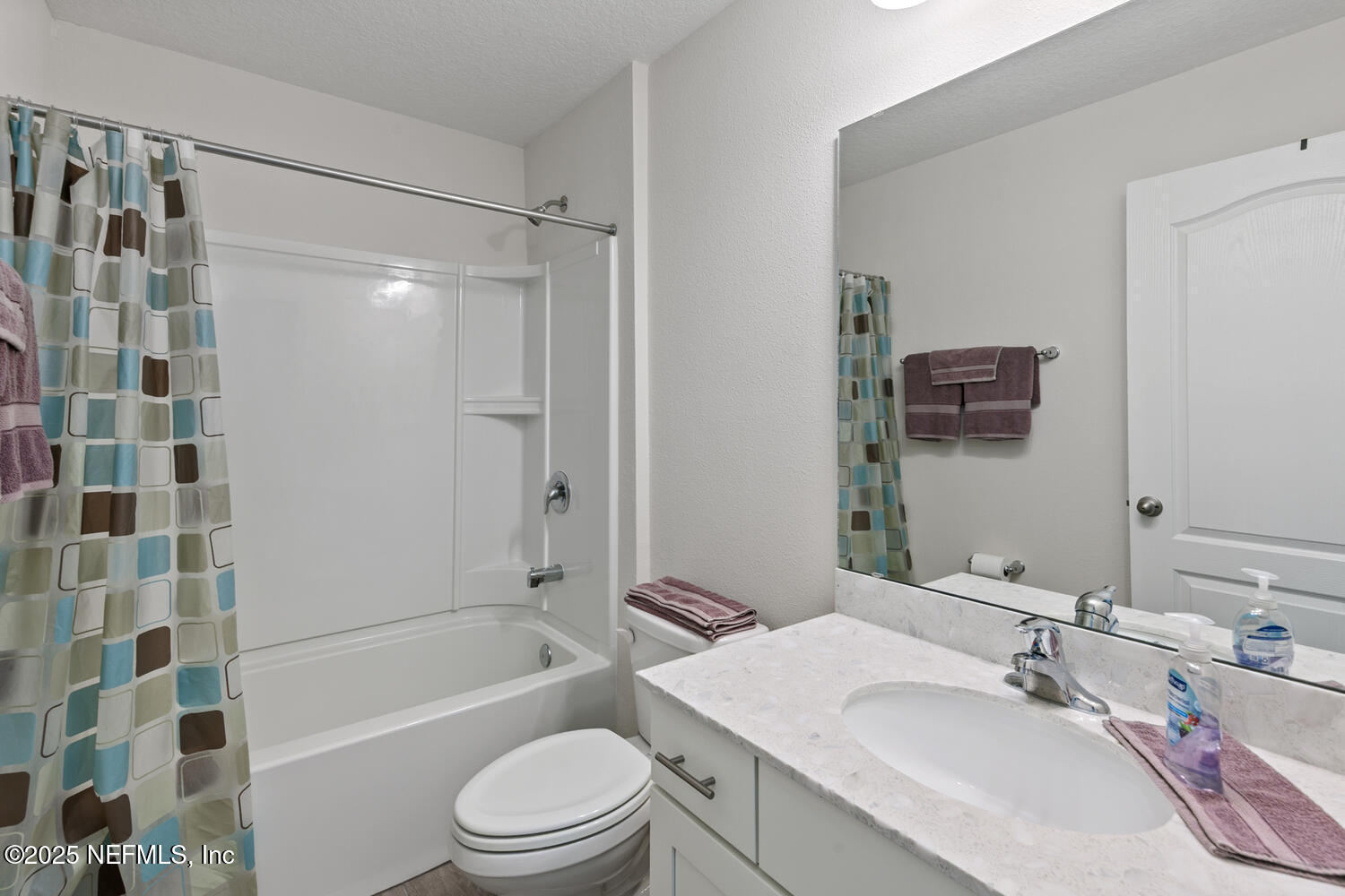 352 Chasewood Drive St. Augustine, FL 32095 - Photo 15 of 29 a bathroom with a granite countertop bathtub shower sink vanity mirror and toilet