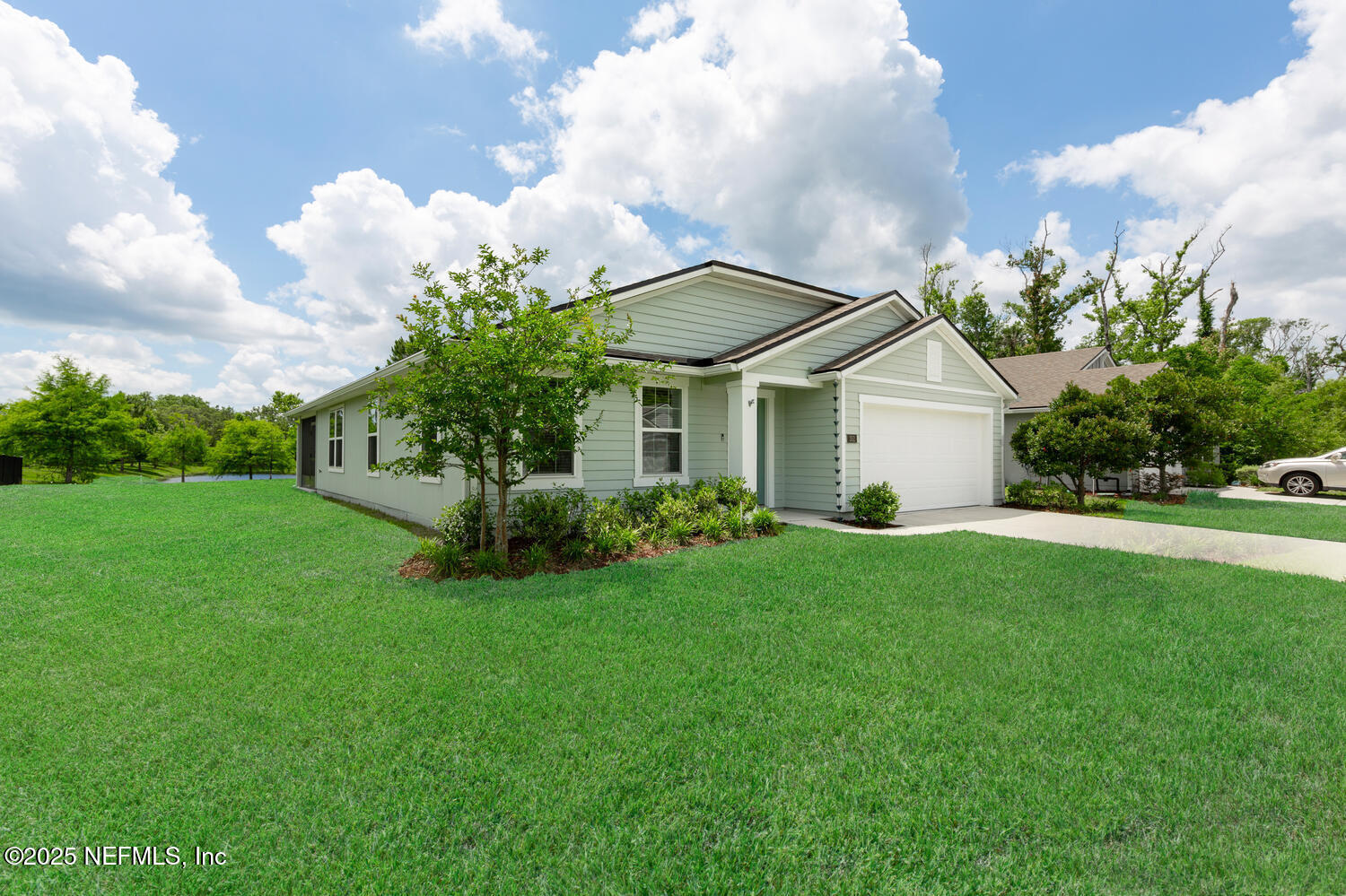 352 Chasewood Drive St. Augustine, FL 32095 - Photo 2 of 29 a front view of a house with garden