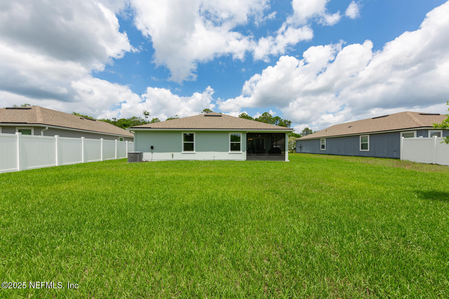 352 Chasewood Drive St. Augustine, FL 32095 - Photo 27 of 29 a view of a house with a big yard and garden