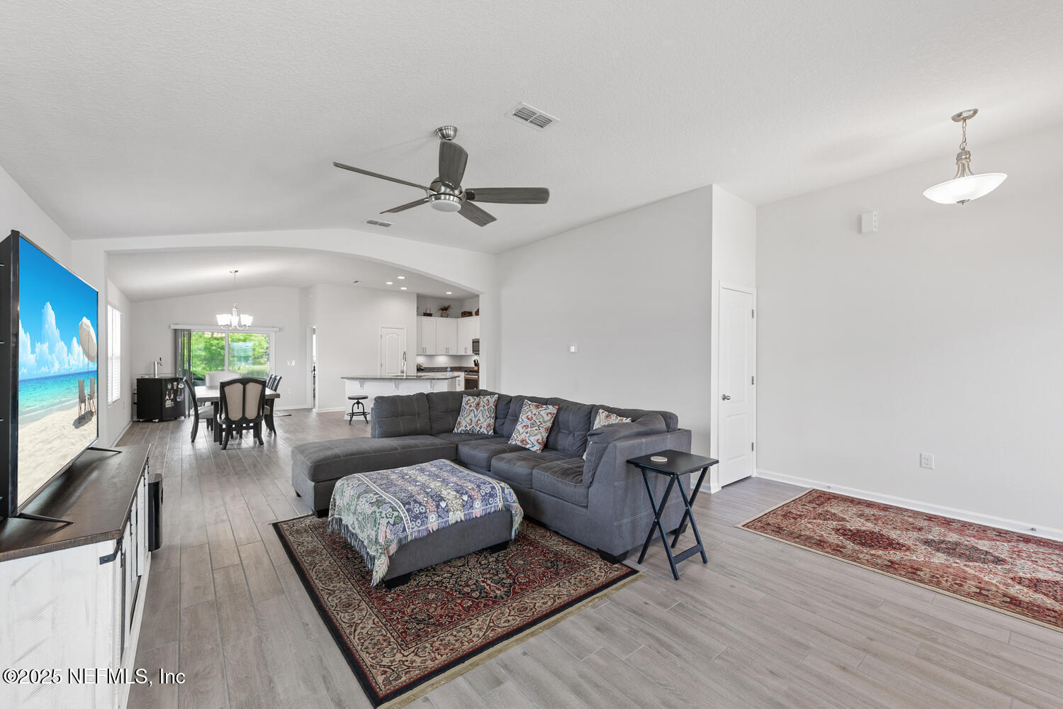 352 Chasewood Drive St. Augustine, FL 32095 - Photo 4 of 29 a living room with furniture and a flat screen tv