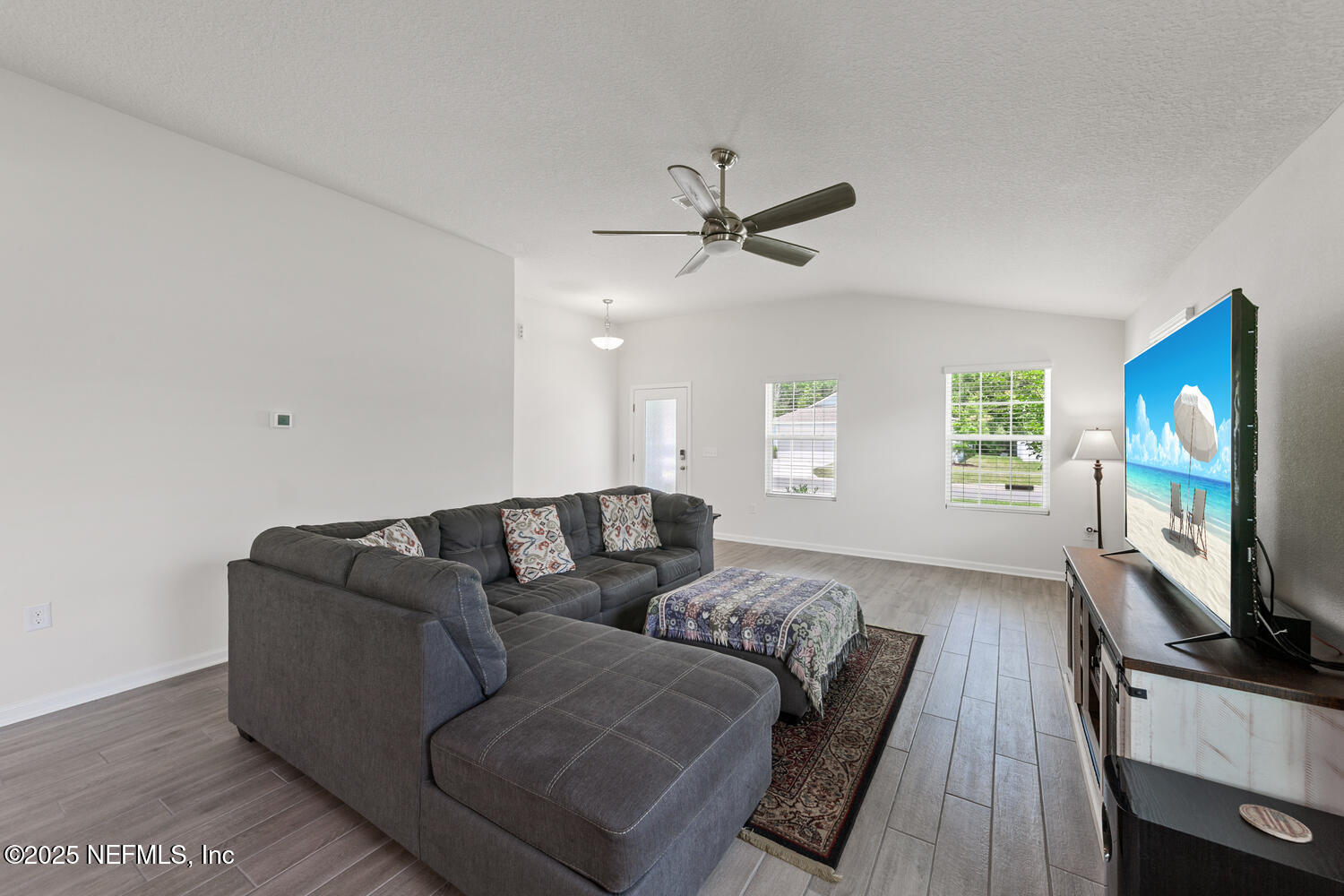 352 Chasewood Drive St. Augustine, FL 32095 - Photo 5 of 29 a living room with furniture and a flat screen tv