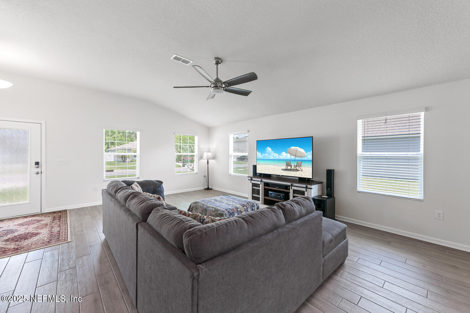 352 Chasewood Drive St. Augustine, FL 32095 - Photo 6 of 29 a living room with furniture a window and a flat screen tv