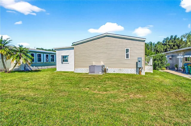a view of a backyard with plants and a patio
