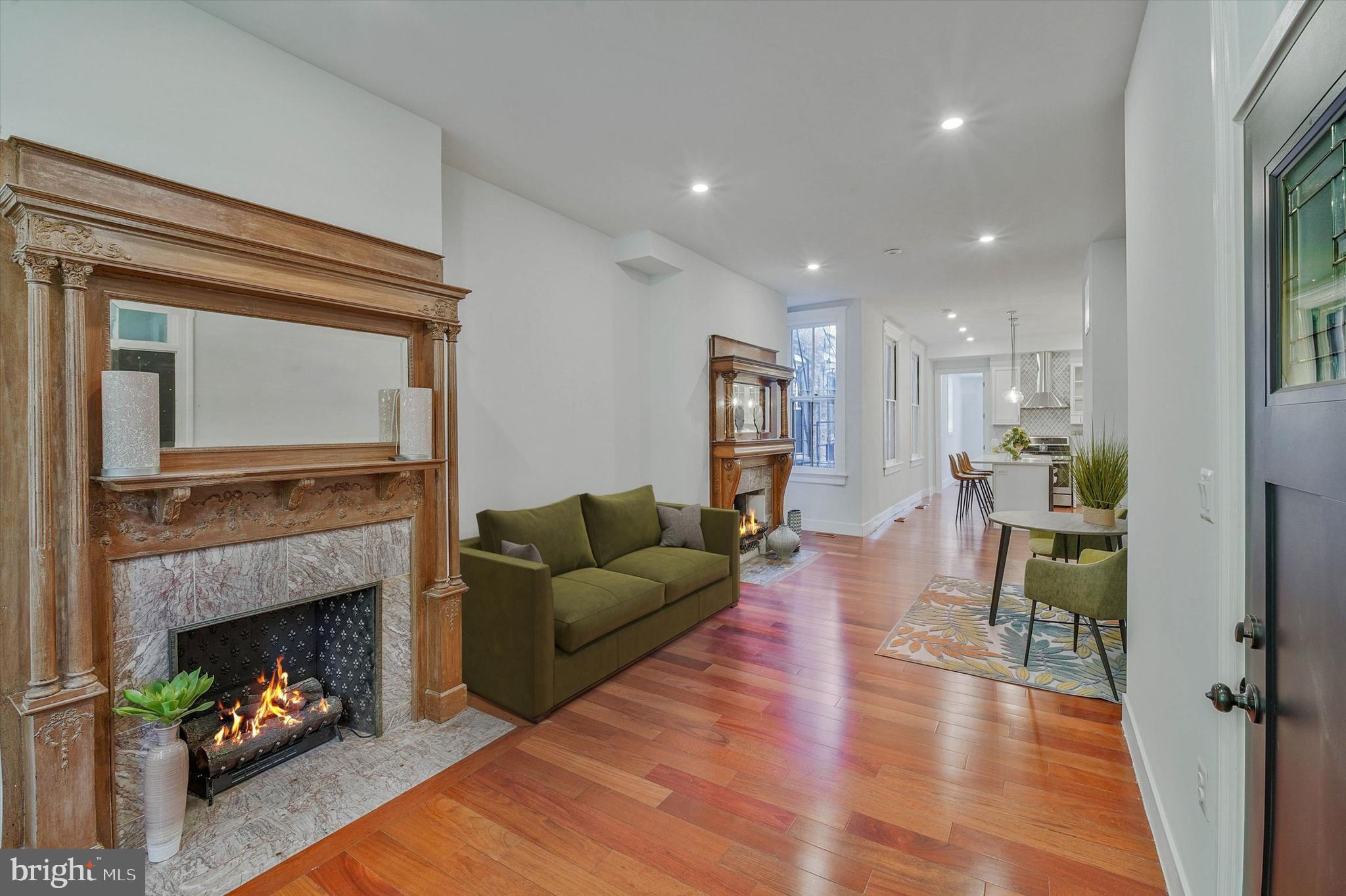 1240 Columbia Road Northwest, Unit 1 Washington, DC 20009 - Photo 1 of 25 a living room with furniture and a fireplace