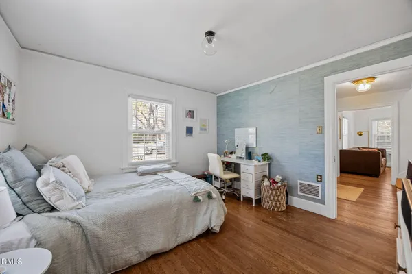 a bedroom with a bed and a couch