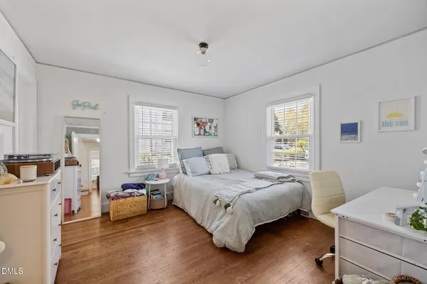 a bedroom with a bed and a table in it