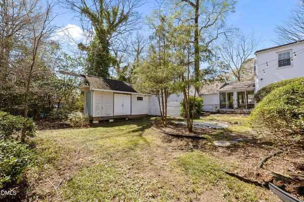 a house with trees in front of it