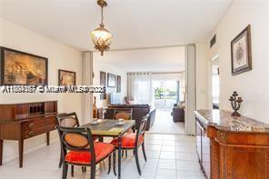 1980 South Ocean Drive, Unit 2B Hallandale Beach, FL 33009 - Photo 3 of 9 a view of a dining room with furniture and a chandelier