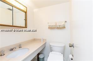 1980 South Ocean Drive, Unit 2B Hallandale Beach, FL 33009 - Photo 6 of 9 a bathroom with a sink and a toilet