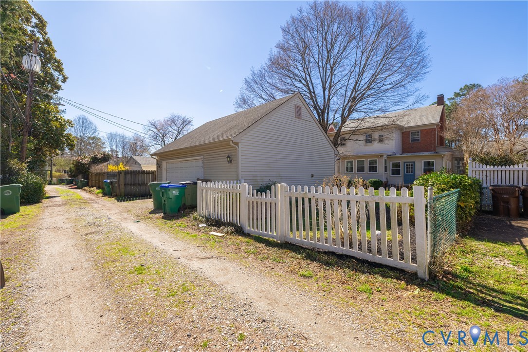 5013 Caledonia Road Richmond, VA 23225 - Photo 54 of 57 a view of a house with wooden fence
