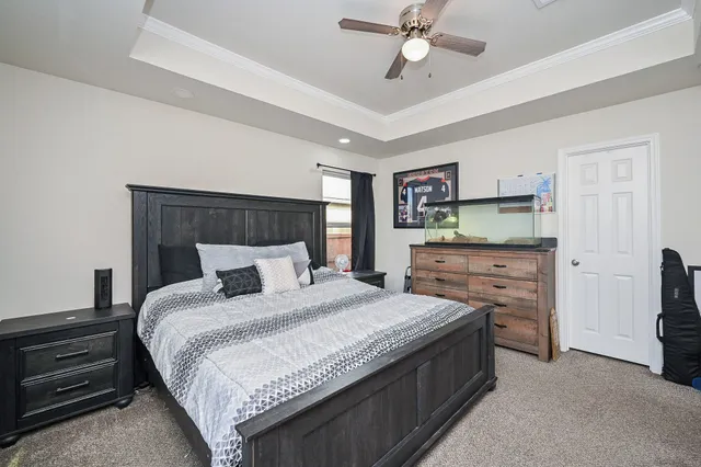 a bedroom with a bed and a dresser