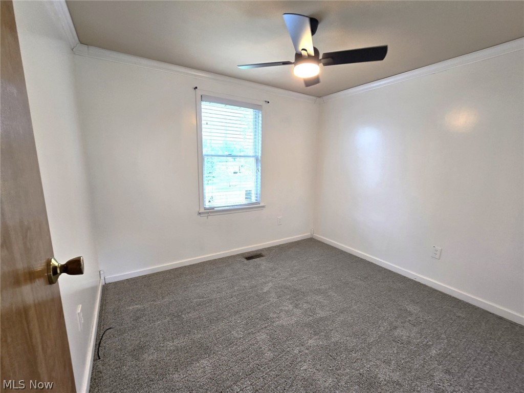 28365 Osborne Road Coolville, OH 45723 - Photo 33 of 49 Office/possible 4th bedroom / Recessed window with blinds, overhead ceiling fan with lighting, wall-to-wall carpeting, and crown molding
