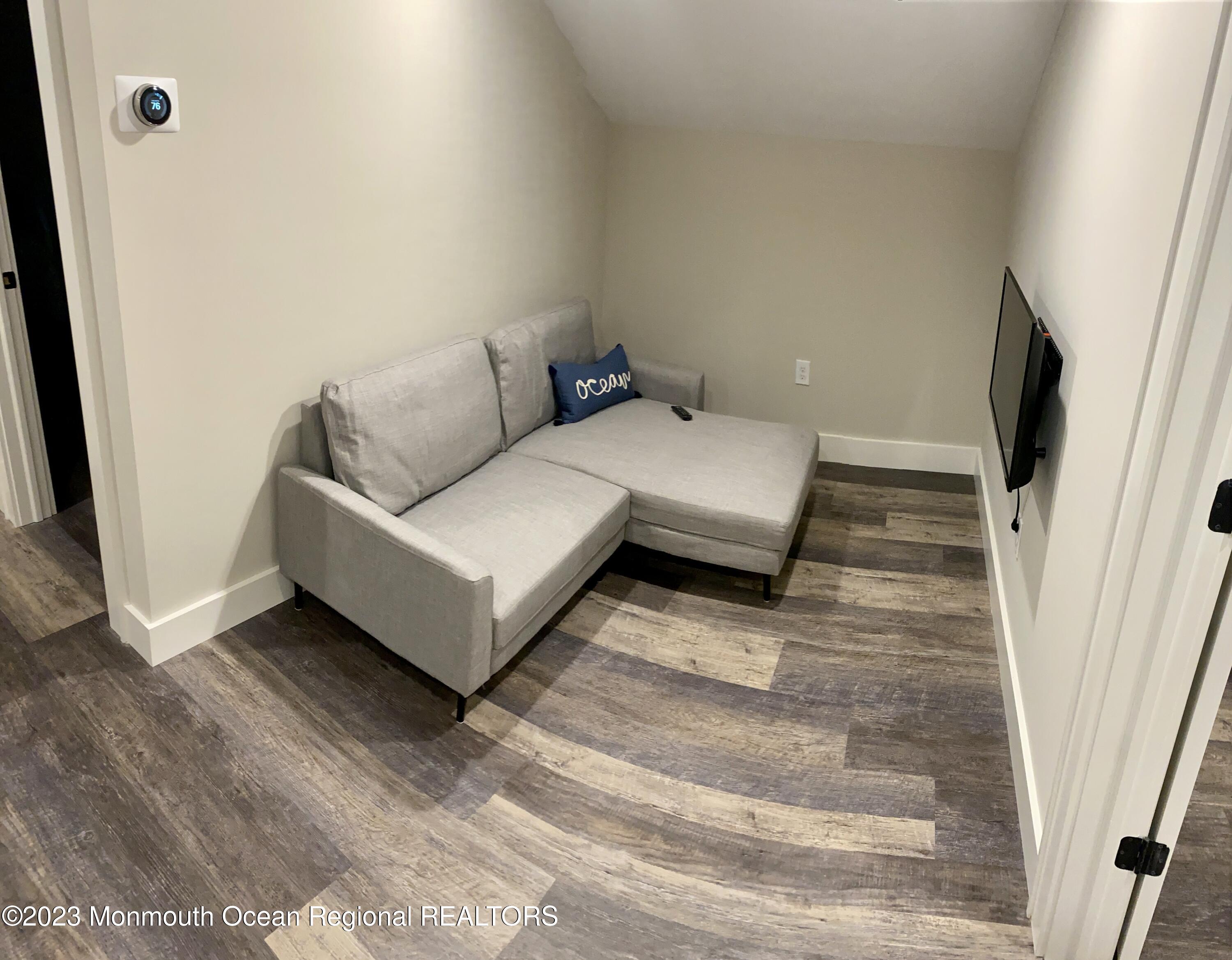 447 East Main Street Manasquan, NJ 08736 - Photo 14 of 18 a living room with furniture and a rug