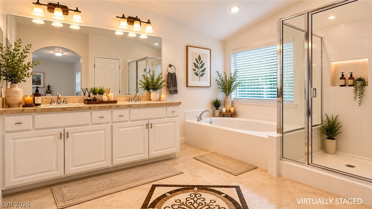 87 Tall Ruff Drive Las Vegas, NV 89148 - Photo 61 of 71 Luxurious bathing retreat boasts dual vanities, a separate soaking tub, and an inviting glass-enclosed shower.