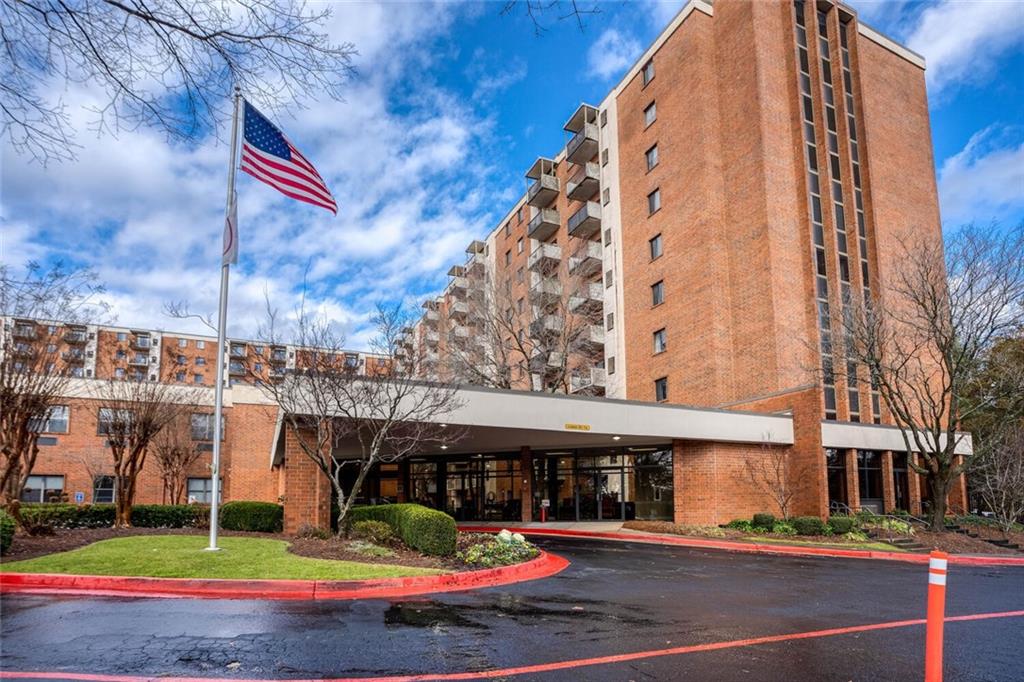 300 Johnson Ferry Road, Unit A305 Atlanta, GA 30328 - Photo 16 of 27 a view of a building with a yard