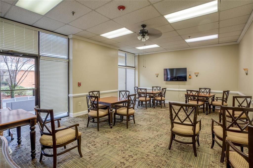 300 Johnson Ferry Road, Unit A305 Atlanta, GA 30328 - Photo 18 of 27 a view of a dining room with furniture window and outside view