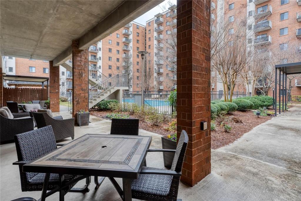 300 Johnson Ferry Road, Unit A305 Atlanta, GA 30328 - Photo 20 of 27 a view of city from balcony with outdoor seating