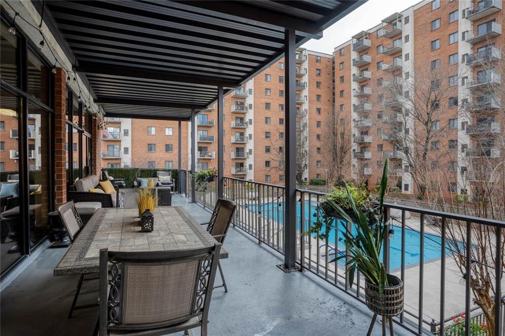 300 Johnson Ferry Road, Unit A305 Atlanta, GA 30328 - Photo 21 of 27 a view of an outdoor space with seating