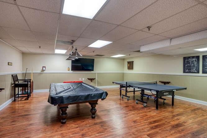 300 Johnson Ferry Road, Unit A305 Atlanta, GA 30328 - Photo 26 of 27 a room with furniture pool table wooden floor and windows