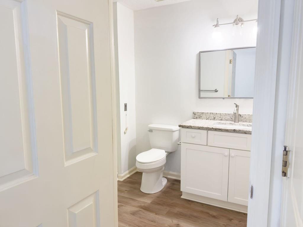 300 Johnson Ferry Road, Unit A305 Atlanta, GA 30328 - Photo 7 of 27 a bathroom with a toilet sink and mirror