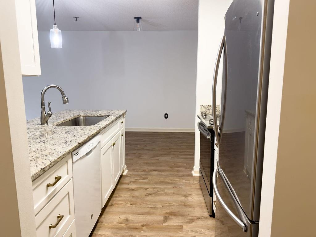 300 Johnson Ferry Road, Unit A305 Atlanta, GA 30328 - Photo 8 of 27 a bathroom with a granite countertop sink a toilet and shower