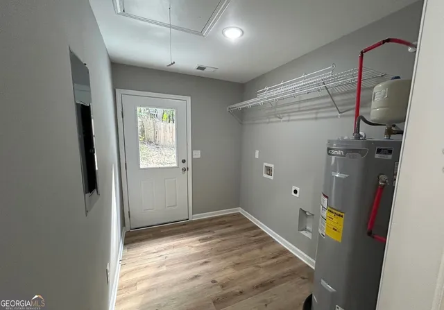 a view of an entryway with wooden floor