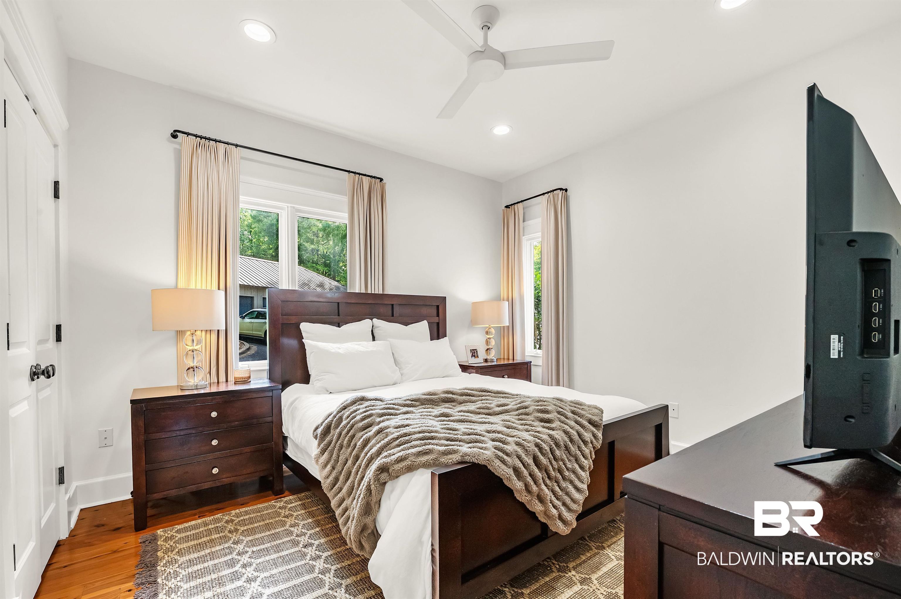 32760 Steelwood Ridge Road, Unit 7 Loxley, AL 36551 - Photo 13 of 64 Bedroom with wood finished floors, recessed lighting, ceiling fan, and baseboards