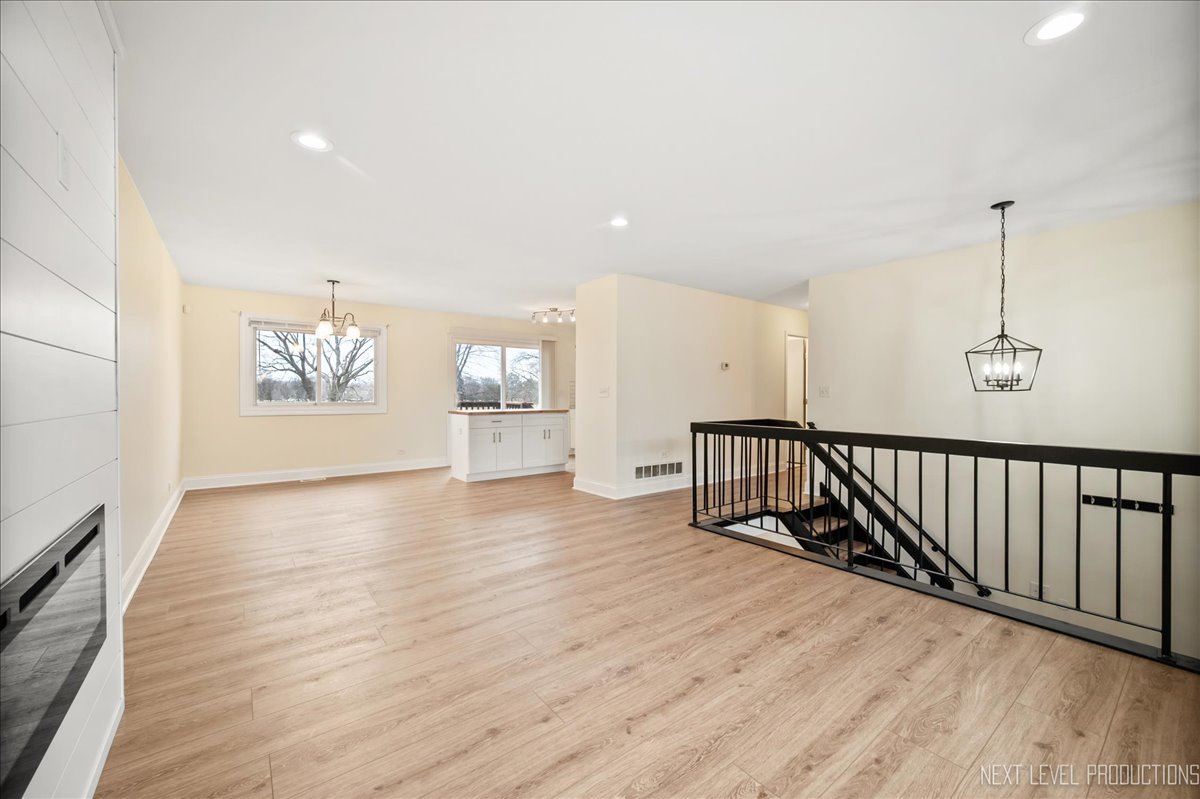 5628 Crestwood Road Matteson, IL 60443 - Photo 11 of 30 a view of an empty room with wooden floor and a window