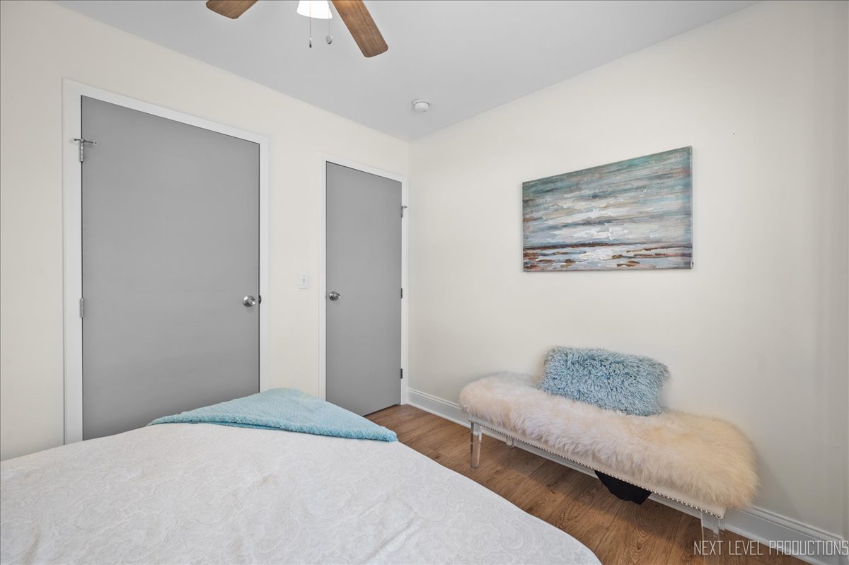 5628 Crestwood Road Matteson, IL 60443 - Photo 15 of 30 a bedroom with a bed and a couch