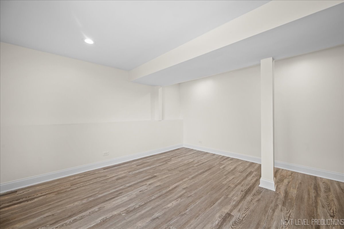 5628 Crestwood Road Matteson, IL 60443 - Photo 21 of 30 a view of an empty room with wooden floor