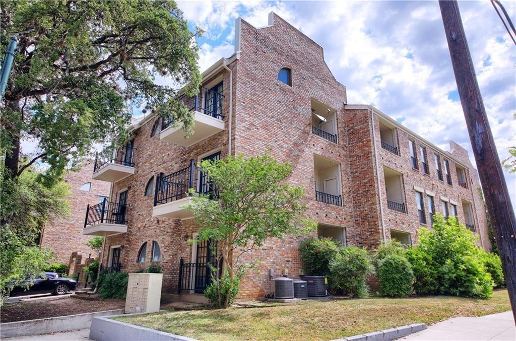 2801 Rio Grande Street, Unit 104 Austin, TX 78705 - Photo 8 of 9 a view of a building with a yard