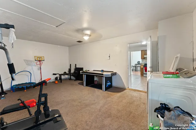 a room with furniture and a flat screen tv