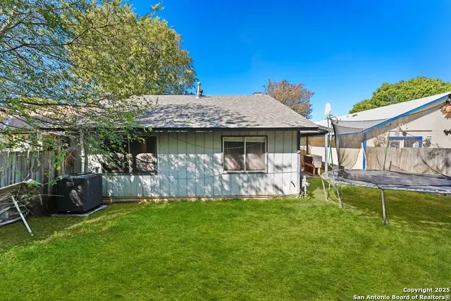 a view of a house with a yard porch and sitting area