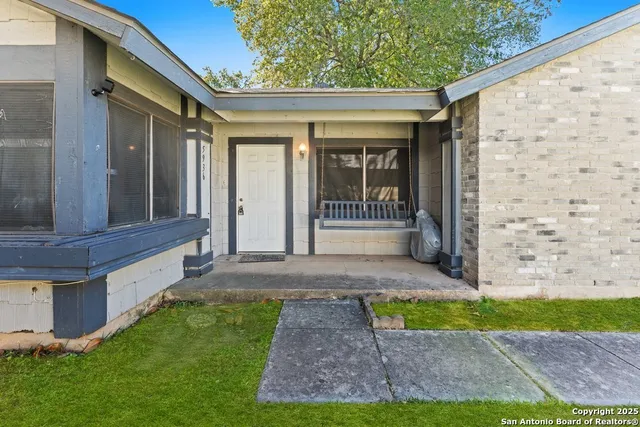 a view of house with backyard and outdoor space