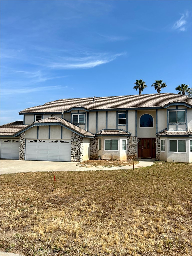 16542 Tava Lane Riverside, CA 92504 - Photo 1 of 1 a front view of a house with a yard