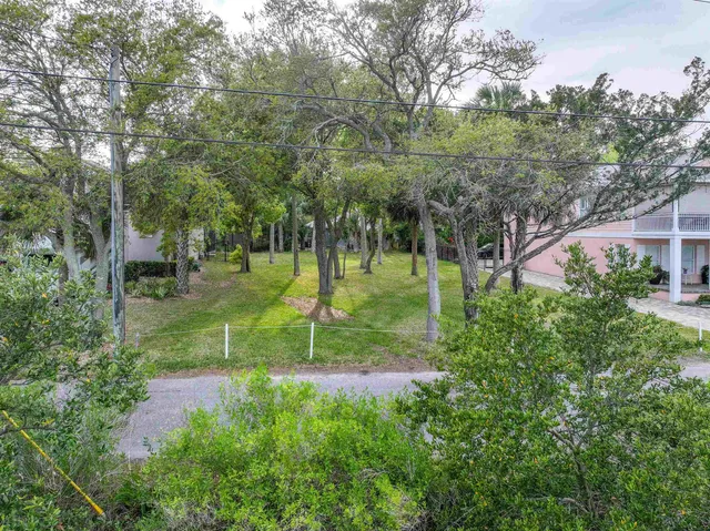 a swimming pool with lots of tress in front of it