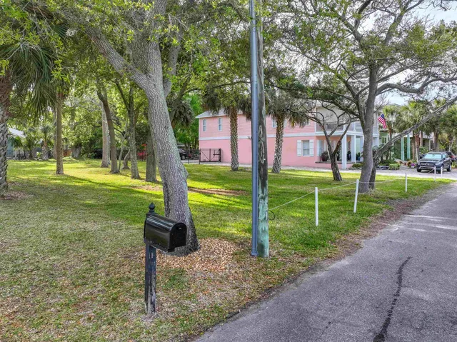 a backyard of a house with table and chairs