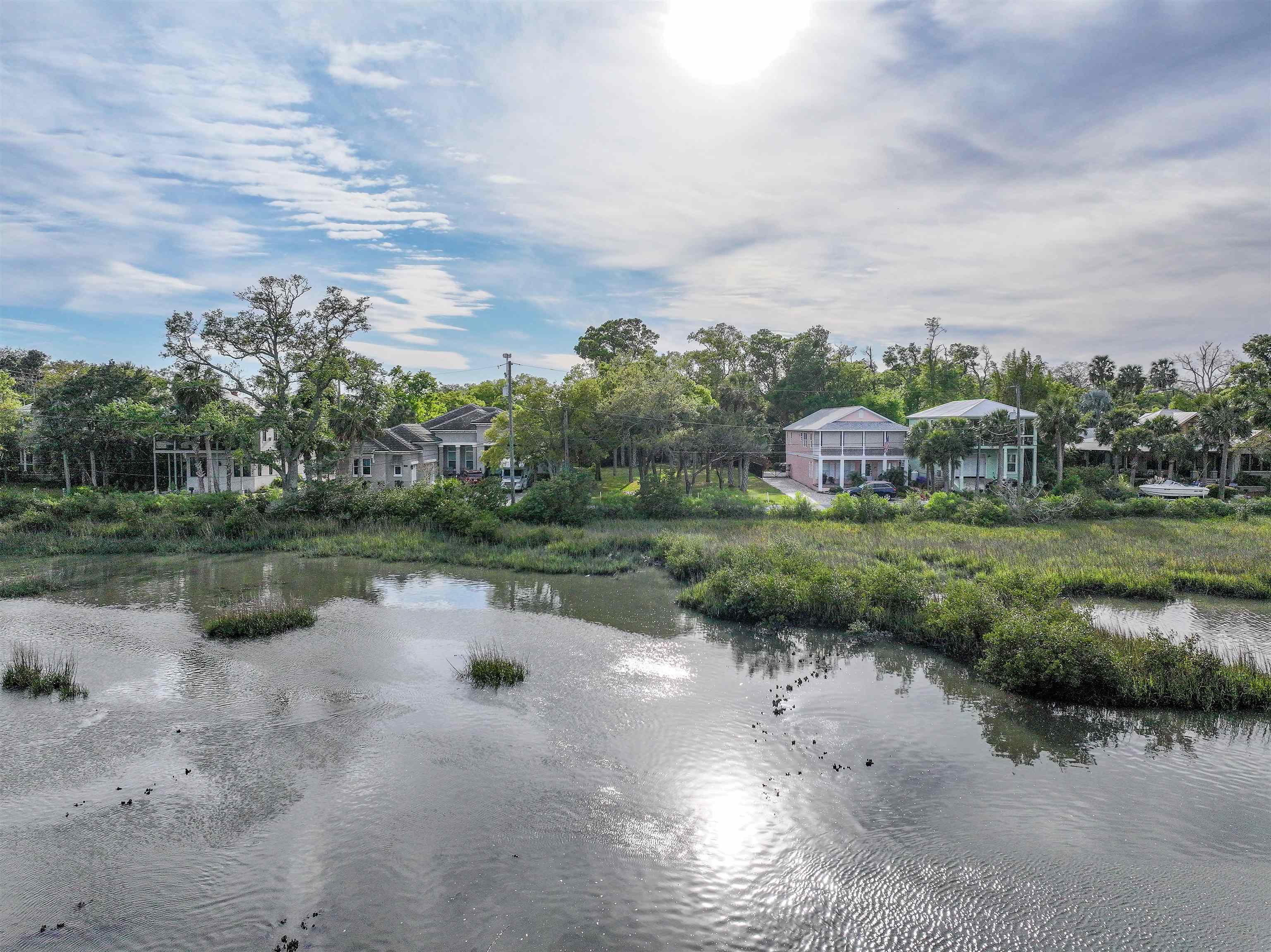 160 Washington Street St. Augustine, FL 32084 - Photo 32 of 56 a view of a lake with a yard