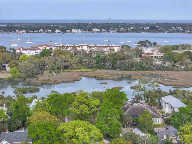 an aerial view of a house with a lake view