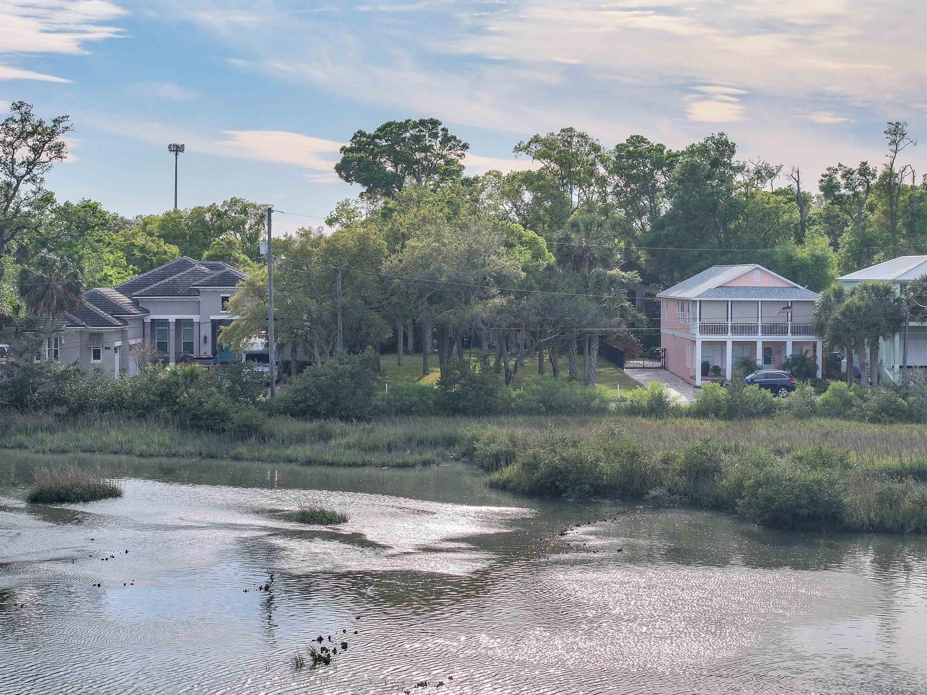 160 Washington Street St. Augustine, FL 32084 - Photo 6 of 56 a front view of a house with a yard