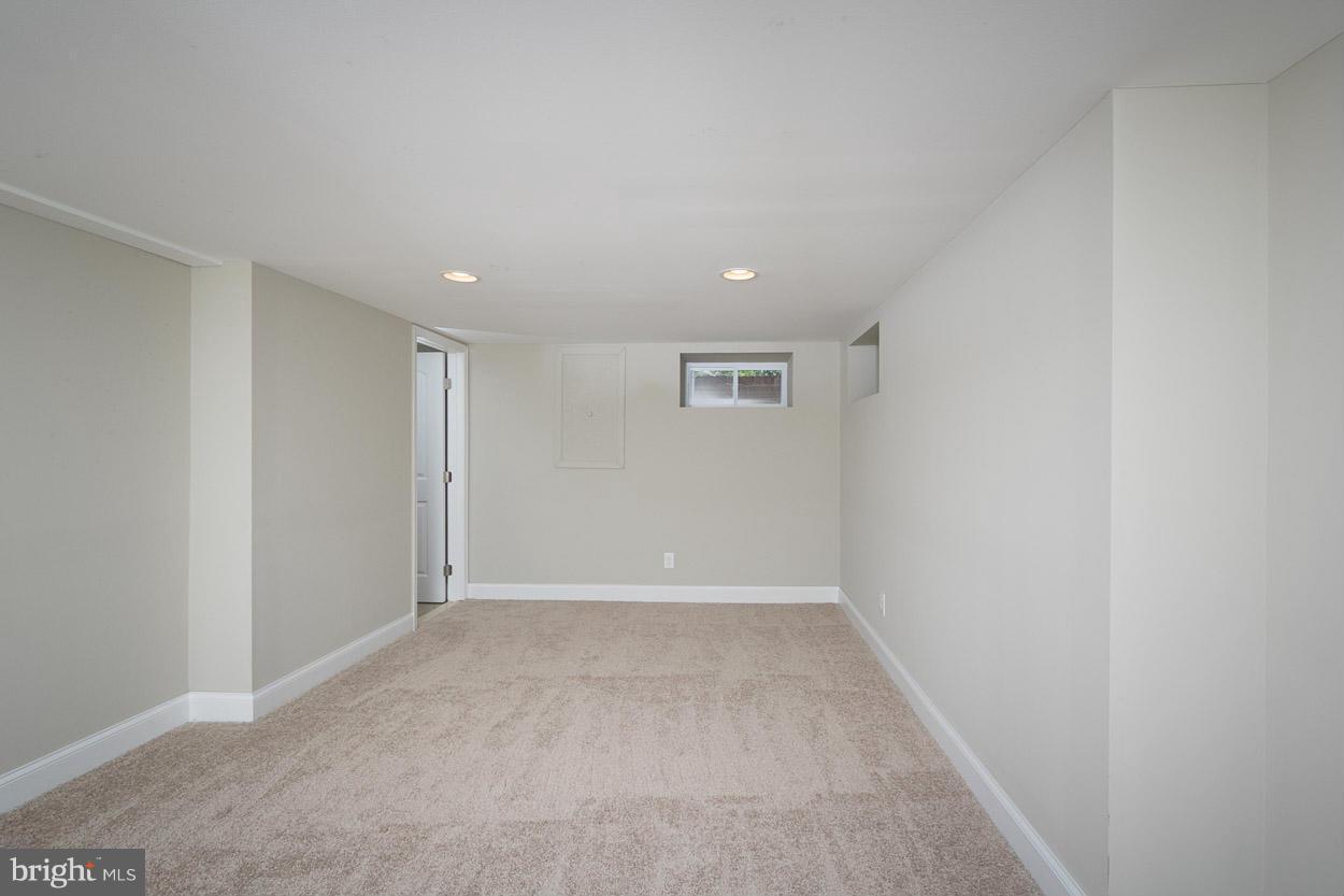 3717 Croydon Road Baltimore, MD 21207 - Photo 22 of 30 an empty room with a empty space and windows