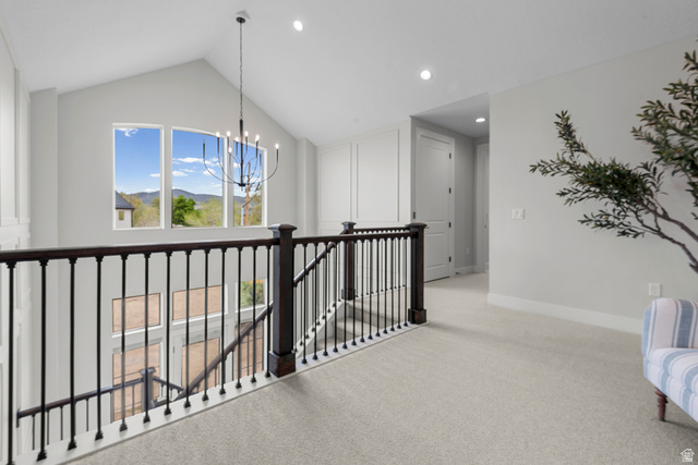 250 South Main Street, Unit 24 Alpine, UT 84004 - Photo 14 of 50 Hall with light colored carpet, an upstairs landing, suspended lighting, and a mountain view