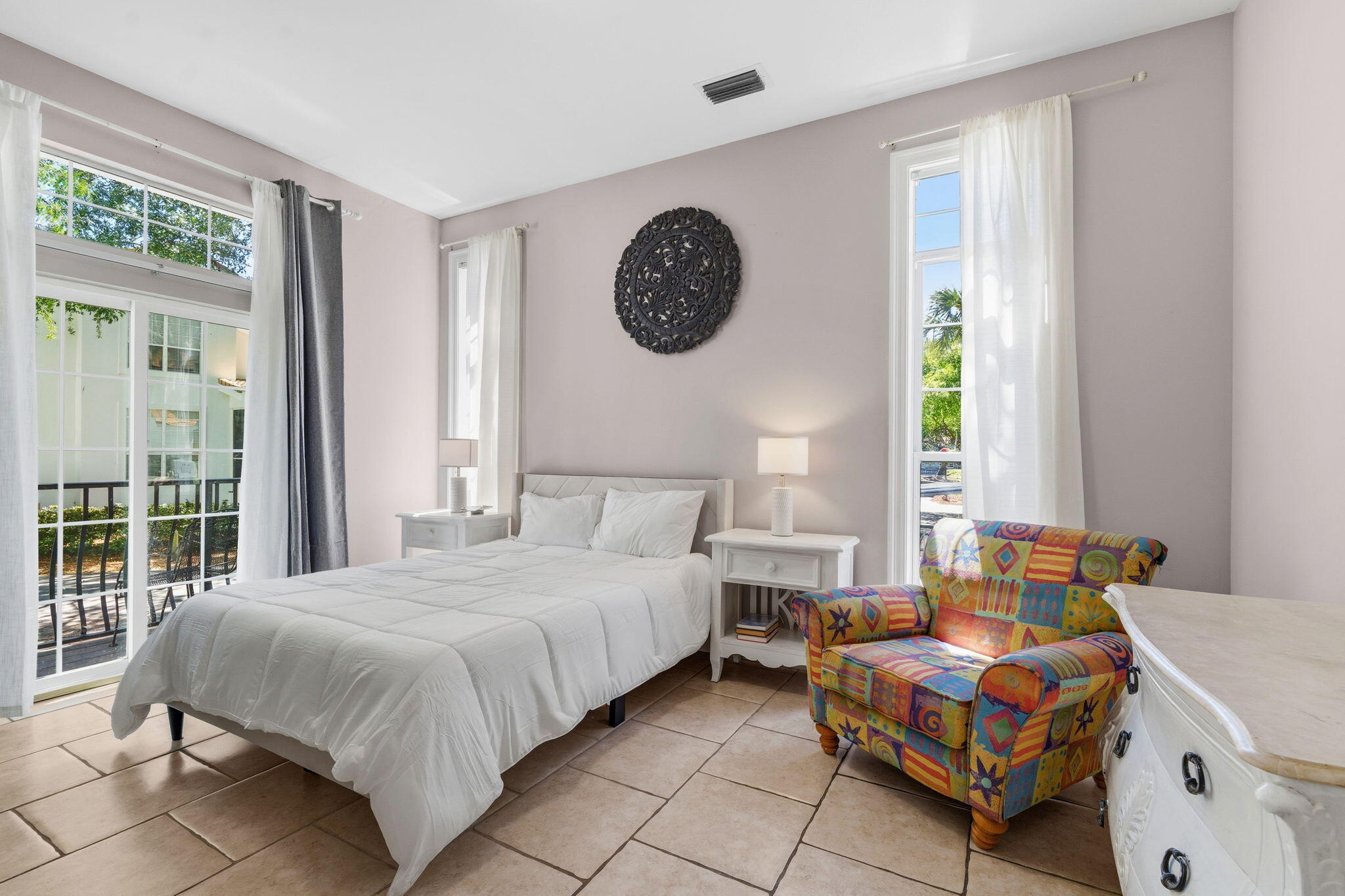 65 Vantage Point Miramar Beach, FL 32550 - Photo 22 of 63 a bedroom with a bed a lamp and a large window