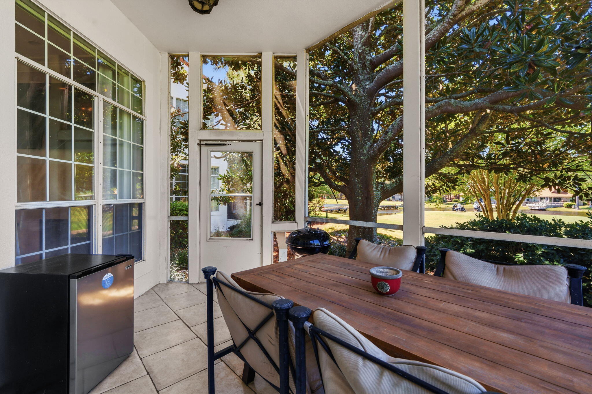 65 Vantage Point Miramar Beach, FL 32550 - Photo 55 of 63 a view of a house with backyard wooden floor and a tree
