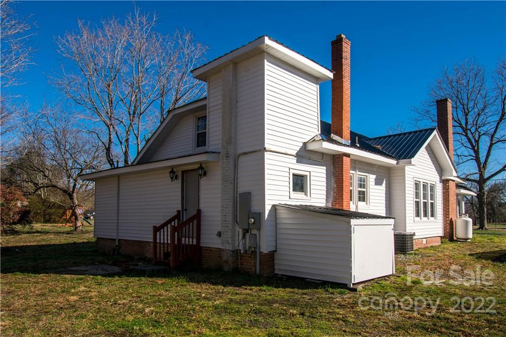 1925 Tryon Courthouse Road Bessemer City, NC 28016 - Photo 4 of 27 a view of a house with a yard
