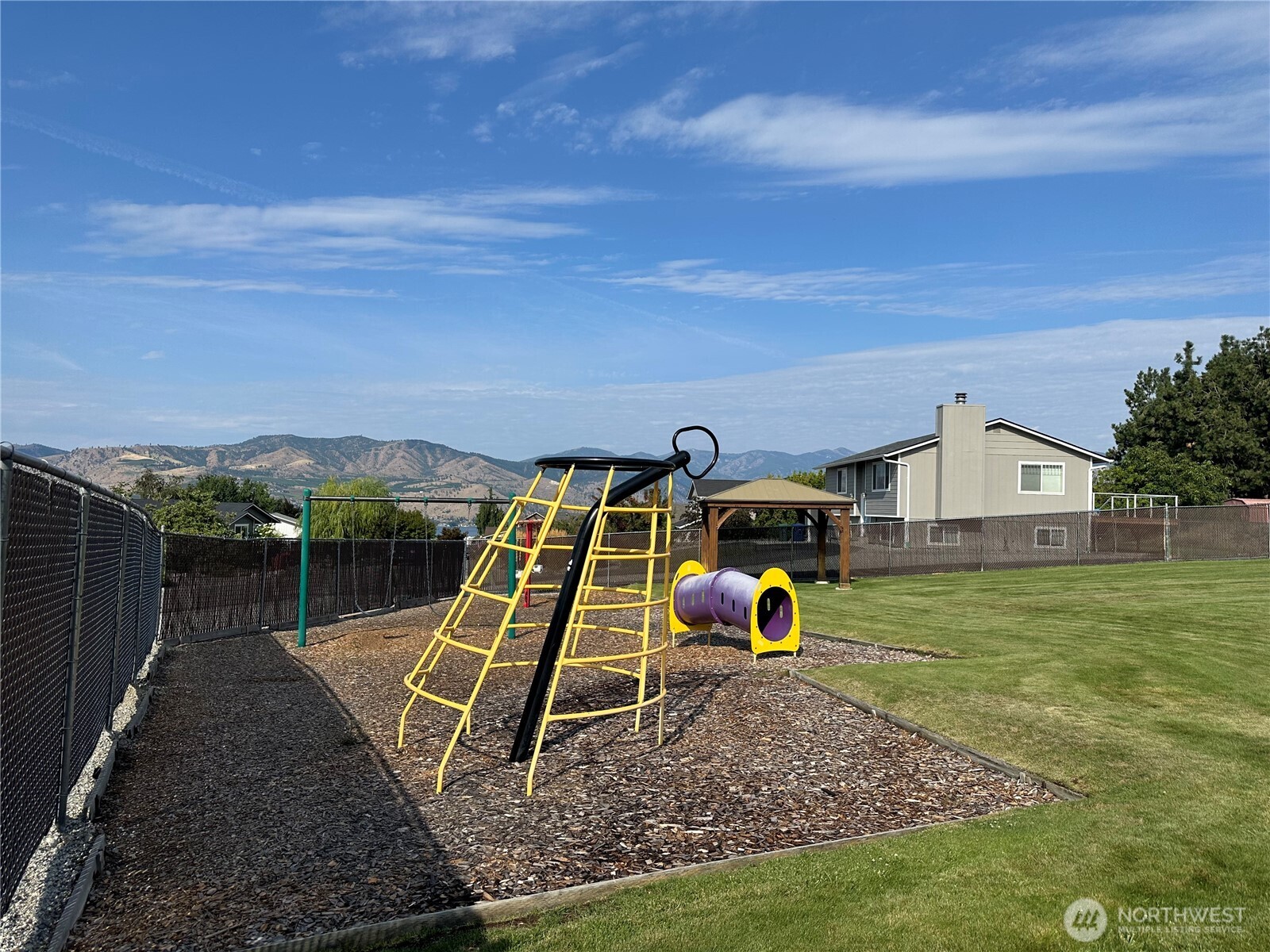 211 Pinnacle Place Chelan, WA 98816 - Photo 11 of 28 a view of a house with a yard