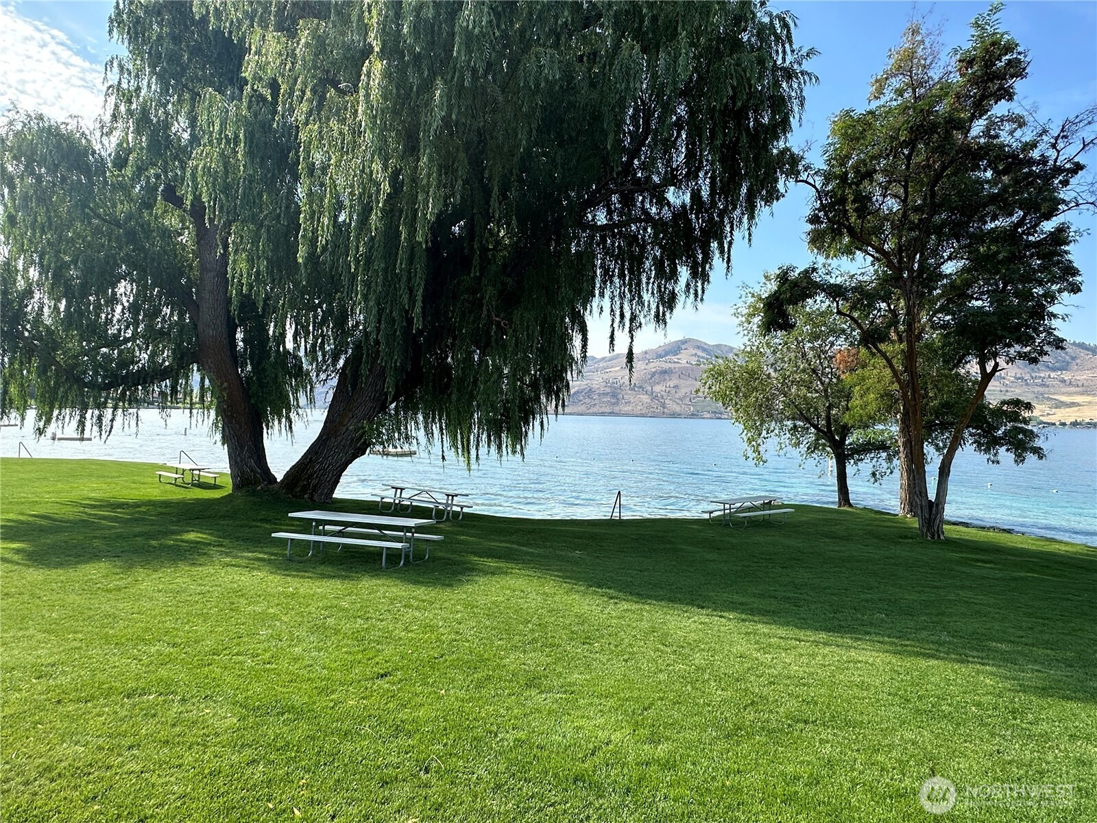 211 Pinnacle Place Chelan, WA 98816 - Photo 13 of 28 a view of a swimming pool and trees