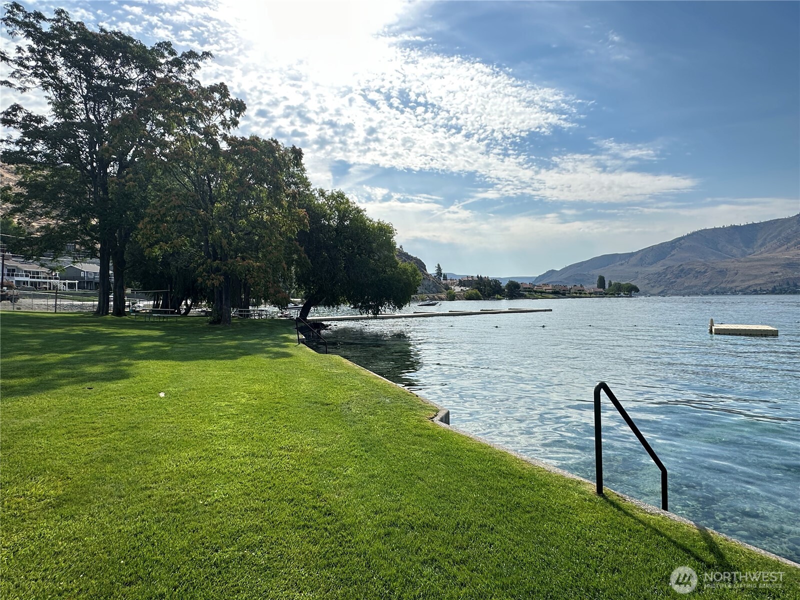 211 Pinnacle Place Chelan, WA 98816 - Photo 16 of 28 a view of a lake with houses in the background